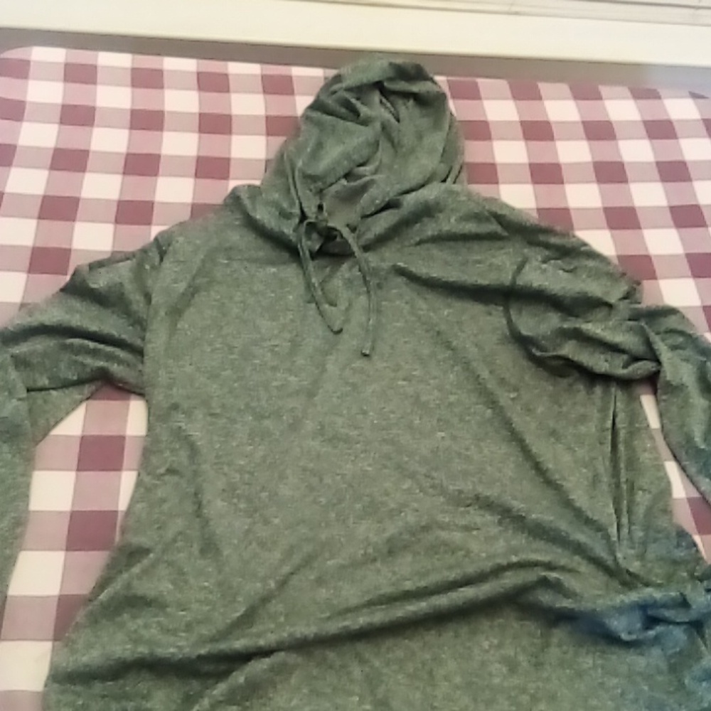 Women's athletic hoodie with draw string and split sleeves.